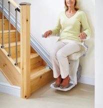 older woman on stair lift